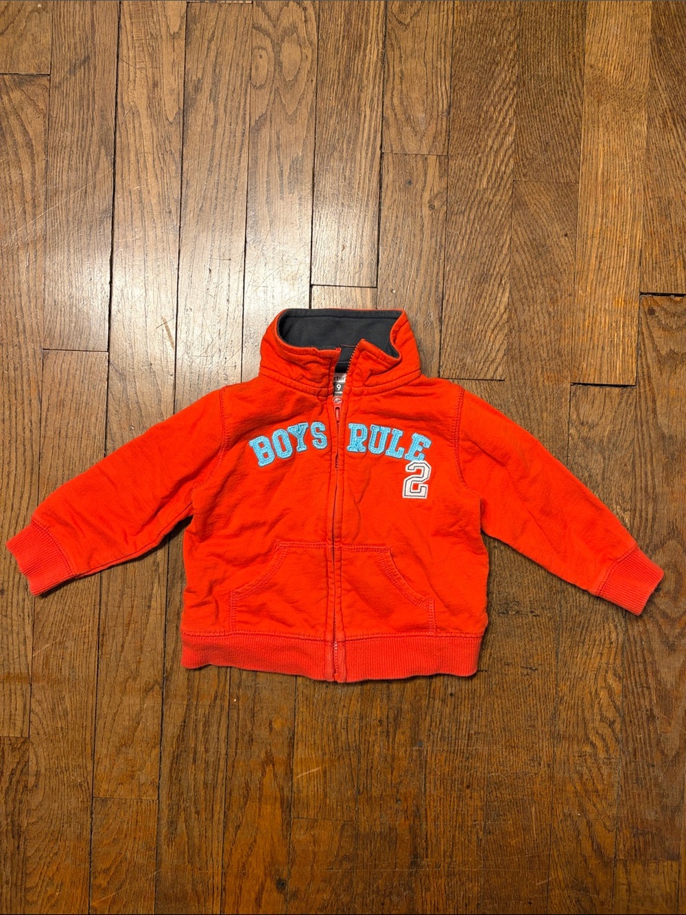 Carter's bright orange zip-up hoodie with charcoal lining and blue lettering